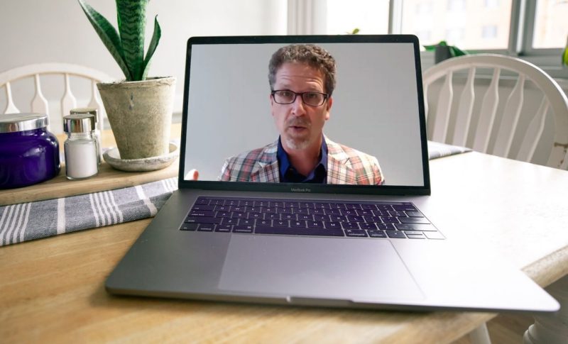 wine instructor on laptop screen 