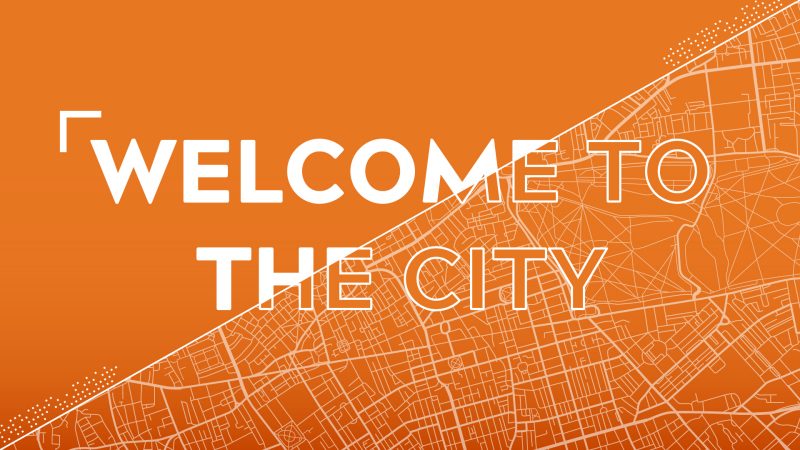 welcome to the city message on orange background with city grid