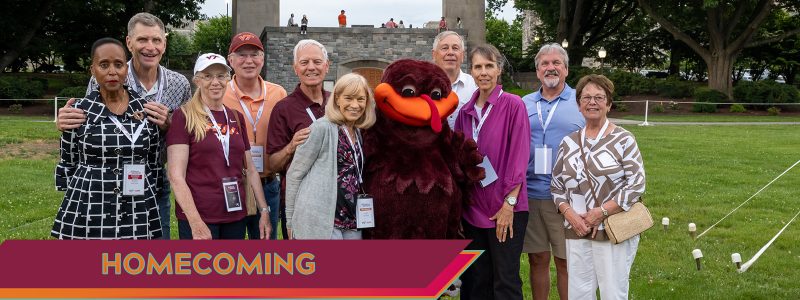 Alumni pose with the HokieBird