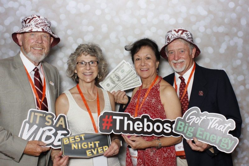 Alumni in photo booth during Alumni Weekend