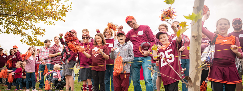 Three Hokies enjoying the Homecoming tailgate