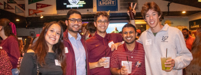 Young alumni at happy hour