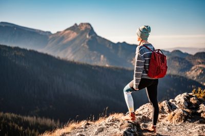 Person looking out at a mountain view