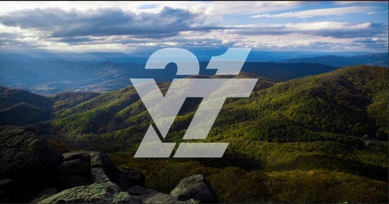 Class of 2021 logo in white with a picture of the Blue Ridge Mountains in the bachground