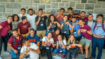 Hokies flash the VT hand sign