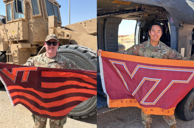 In the photo on the left, Tucker in his camouflage uniform holds a striped VT flag while standing in front of military heavy construction equipment. In the photo on the right, Teh in his camouflage uniform stands with a VT flag in front of a military helicopter.